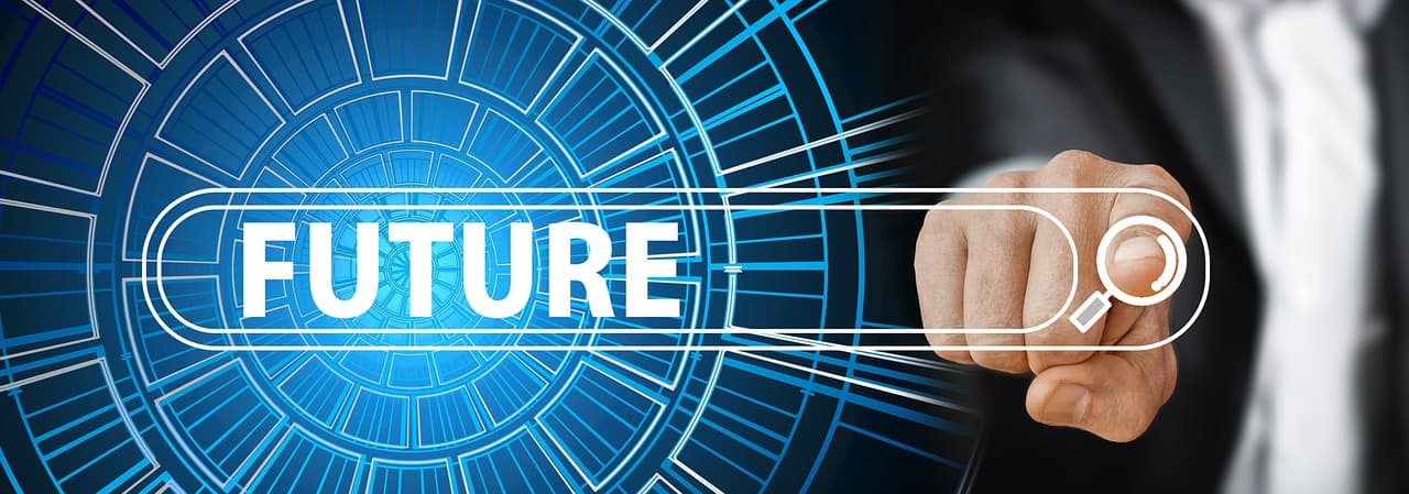 A hand reaching toward the word future